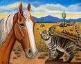 A palimino horse is standing next to a brown tabby cat with a Arizona backdrop.
