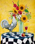 A black and white rooster standing on a black and white table cloth with a vase of flowers containg sun flowers and gladiolas.