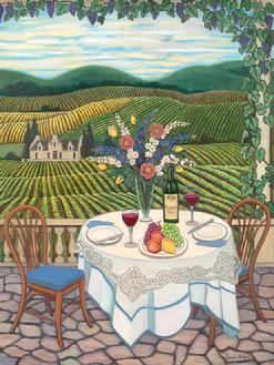 A beautifully set table with two chairs ,wine and flowers romantically awaits you to join over looking vineyards.